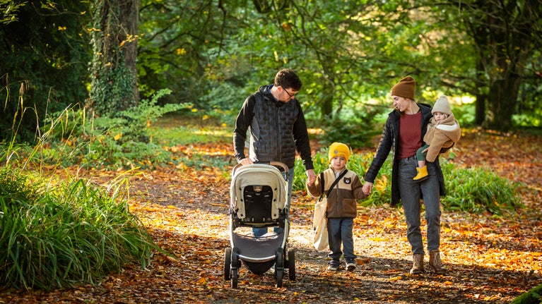 Family enjoying a stroll through Rowallane Garden in autumn